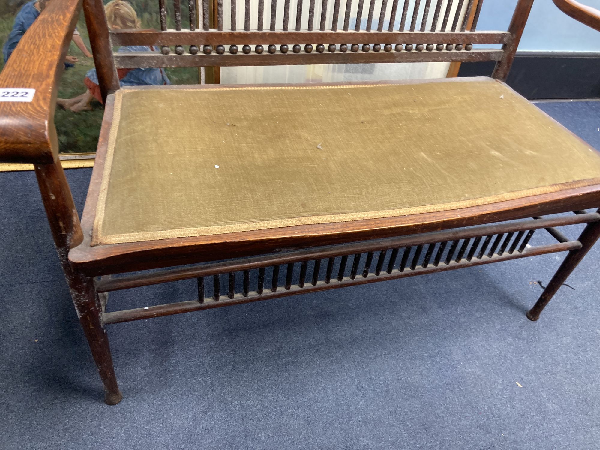 An early 20th century oak two seater chair back settee, width 100cm, depth 50cm, height 99cm